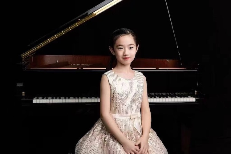 Child prodigy Letao Li seated at the piano